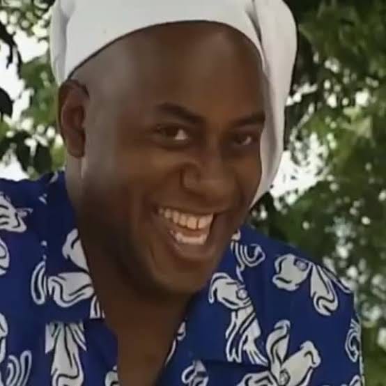 A man grinning knowingly